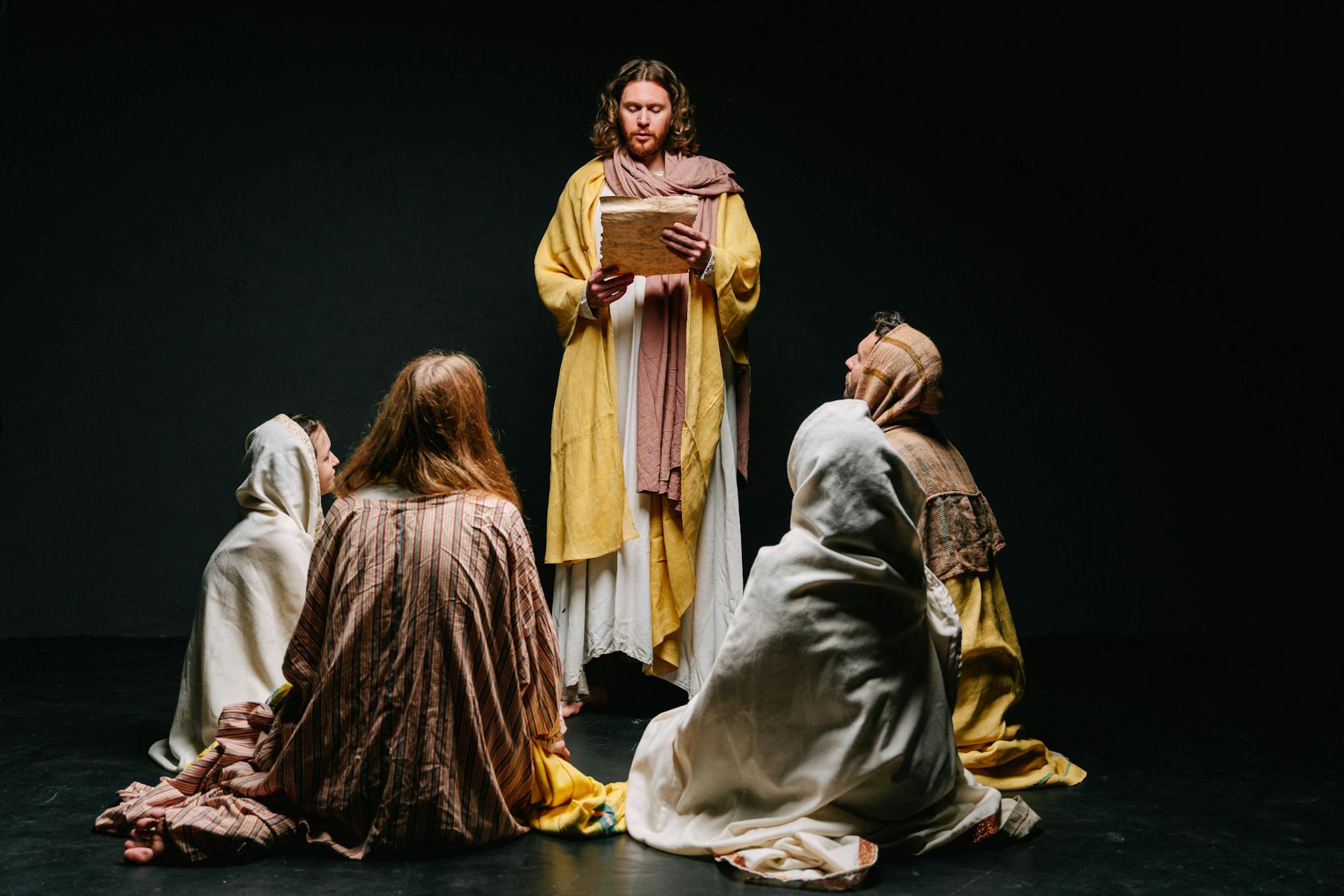 men and women in jesus christ and apostles costumes